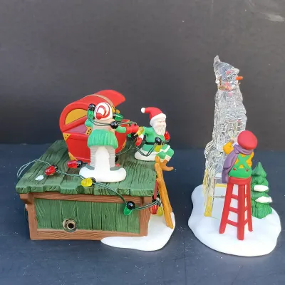 LOT 131: Department 56 Peppermint Skating Party, Untangle the Christmas Lights, A Busy Elf and Elf Bunkhouse