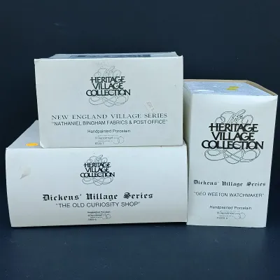 LOT 128: Department 56 Dickens Village Series The Old Curiosity Shop and Geo Weeton Watchmaker with New England Village Series Nathaniel...