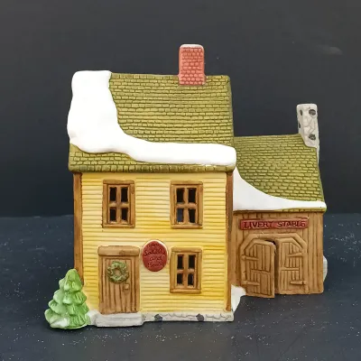 LOT 135: Department 56 New England Village Series Yankee Jud Bell Casting, Livery Stable & Boot Shop and Ben's Barber Shop