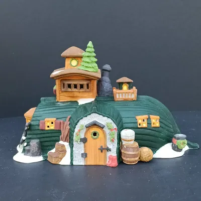 LOT 124: Department 56 Dickens' Village Series Nicholas Nickleby Cottage, Peggoty's Seaside Cottage and Poulterer