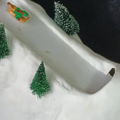 LOT 177: Department 56 Village Animated Hill and North Pole Series Downhill Elves