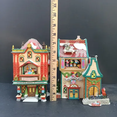 LOT 164: Department 56 North Pole Series Marie's Doll Museum and Jack In The Box Plant No. 2
