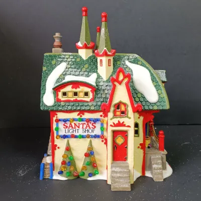 LOT 173: Department 56 North Pole Series Glass Ornament Works and Santa's Light Shop