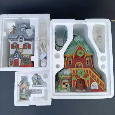 LOT 134: Department 56 North Pole Series Santa's Rooming House, Neenee's Dolls & Toys, and End of the Line
