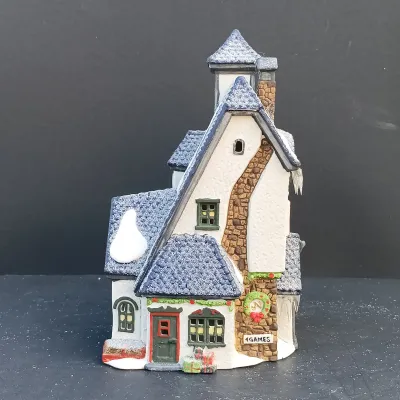 LOT 134: Department 56 North Pole Series Santa's Rooming House, Neenee's Dolls & Toys, and End of the Line