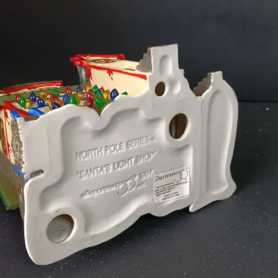 LOT 173: Department 56 North Pole Series Glass Ornament Works and Santa's Light Shop