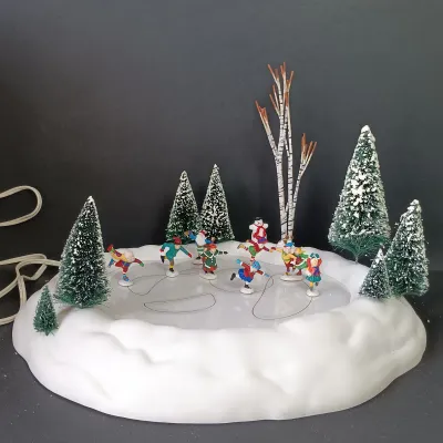 LOT 176: Department 56 Village Animated Skating Pond and North Pole Series Elves on Ice