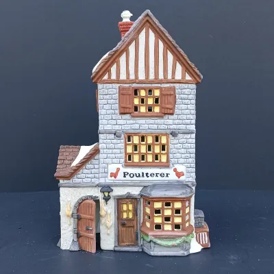 LOT 124: Department 56 Dickens' Village Series Nicholas Nickleby Cottage, Peggoty's Seaside Cottage and Poulterer
