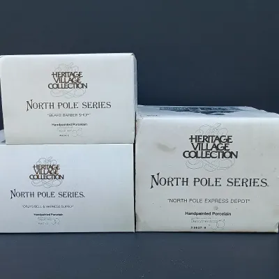 LOT 123: Department 56 North Pole Series Orly's Bell & Harness Supply, North Pole Express Depot and Beard Barber Shop