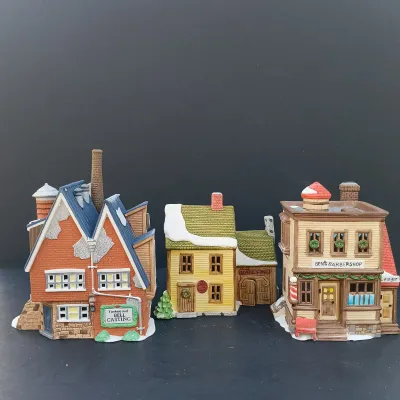 LOT 135: Department 56 New England Village Series Yankee Jud Bell Casting, Livery Stable & Boot Shop and Ben's Barber Shop