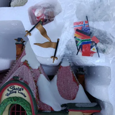 LOT 129: Department 56 North Pole Series Santa's Visiting Center Gift Set with Village Icicle Trees