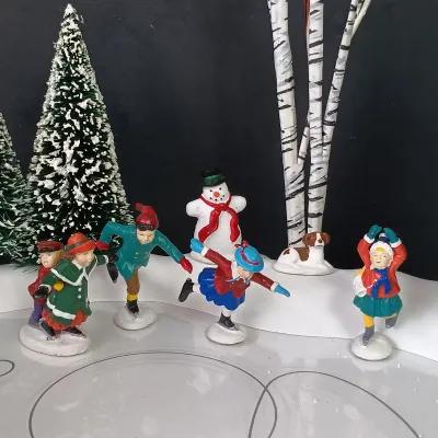 LOT 176: Department 56 Village Animated Skating Pond and North Pole Series Elves on Ice