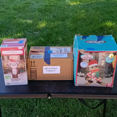 LOT 116: Inflatable 5ft Sock Monkey, 4ft Panda and 4ft Silly Monkey