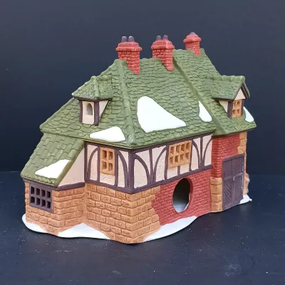 LOT 124: Department 56 Dickens' Village Series Nicholas Nickleby Cottage, Peggoty's Seaside Cottage and Poulterer