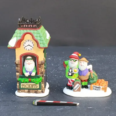 LOT 134: Department 56 North Pole Series Santa's Rooming House, Neenee's Dolls & Toys, and End of the Line