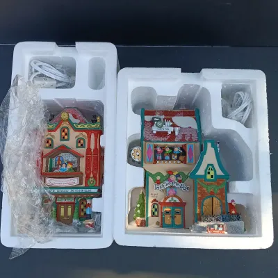 LOT 164: Department 56 North Pole Series Marie's Doll Museum and Jack In The Box Plant No. 2