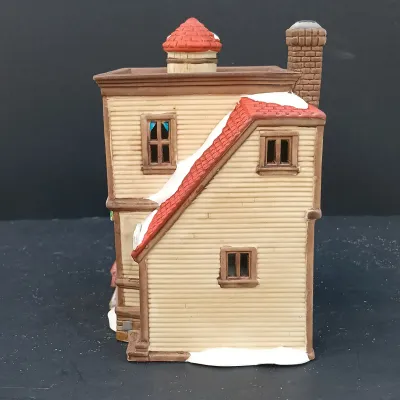 LOT 135: Department 56 New England Village Series Yankee Jud Bell Casting, Livery Stable & Boot Shop and Ben's Barber Shop