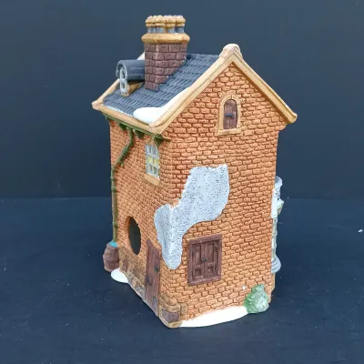 LOT 128: Department 56 Dickens Village Series The Old Curiosity Shop and Geo Weeton Watchmaker with New England Village Series Nathaniel...