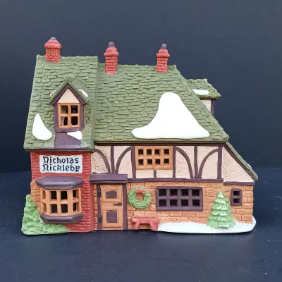 LOT 124: Department 56 Dickens' Village Series Nicholas Nickleby Cottage, Peggoty's Seaside Cottage and Poulterer