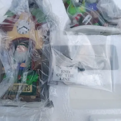 LOT 134: Department 56 North Pole Series Santa's Rooming House, Neenee's Dolls & Toys, and End of the Line