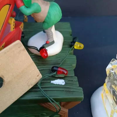 LOT 131: Department 56 Peppermint Skating Party, Untangle the Christmas Lights, A Busy Elf and Elf Bunkhouse