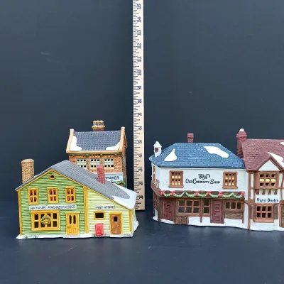 LOT 128: Department 56 Dickens Village Series The Old Curiosity Shop and Geo Weeton Watchmaker with New England Village Series Nathaniel...