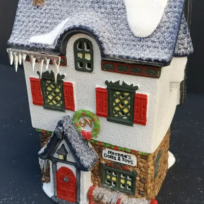 LOT 134: Department 56 North Pole Series Santa's Rooming House, Neenee's Dolls & Toys, and End of the Line