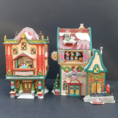LOT 164: Department 56 North Pole Series Marie's Doll Museum and Jack In The Box Plant No. 2