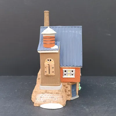 LOT 135: Department 56 New England Village Series Yankee Jud Bell Casting, Livery Stable & Boot Shop and Ben's Barber Shop