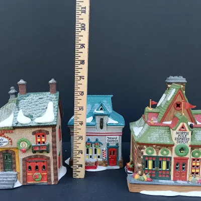 LOT 123: Department 56 North Pole Series Orly's Bell & Harness Supply, North Pole Express Depot and Beard Barber Shop
