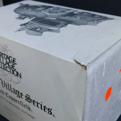 LOT 124: Department 56 Dickens' Village Series Nicholas Nickleby Cottage, Peggoty's Seaside Cottage and Poulterer