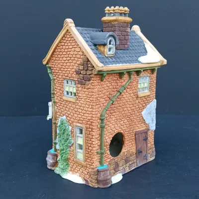 LOT 128: Department 56 Dickens Village Series The Old Curiosity Shop and Geo Weeton Watchmaker with New England Village Series Nathaniel...