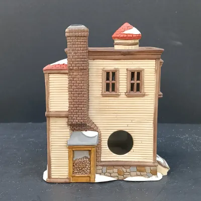 LOT 135: Department 56 New England Village Series Yankee Jud Bell Casting, Livery Stable & Boot Shop and Ben's Barber Shop