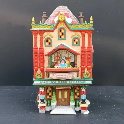 LOT 164: Department 56 North Pole Series Marie's Doll Museum and Jack In The Box Plant No. 2
