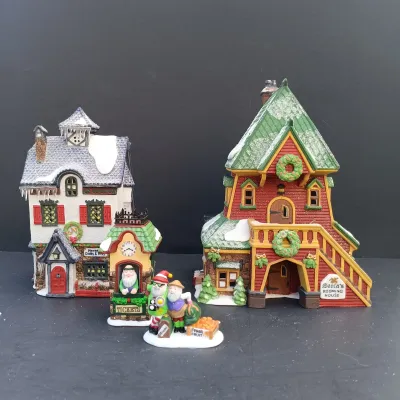 LOT 134: Department 56 North Pole Series Santa's Rooming House, Neenee's Dolls & Toys, and End of the Line