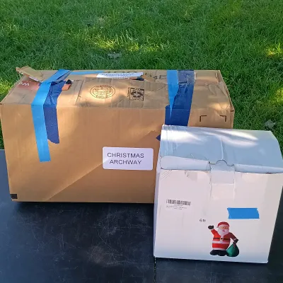LOT 114: Inflatable 6ft Santa and Christmas Archway