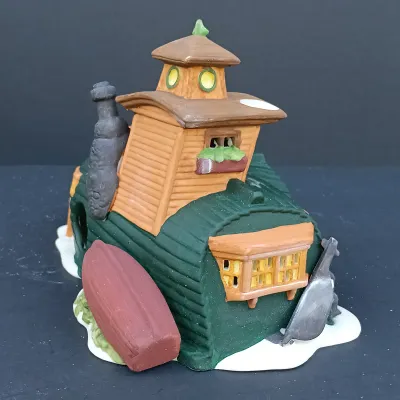 LOT 124: Department 56 Dickens' Village Series Nicholas Nickleby Cottage, Peggoty's Seaside Cottage and Poulterer