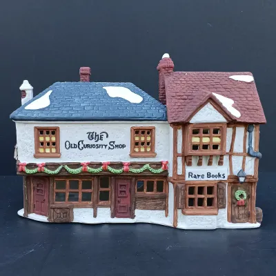 LOT 128: Department 56 Dickens Village Series The Old Curiosity Shop and Geo Weeton Watchmaker with New England Village Series Nathaniel...