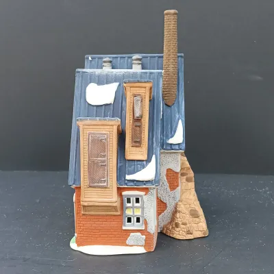 LOT 135: Department 56 New England Village Series Yankee Jud Bell Casting, Livery Stable & Boot Shop and Ben's Barber Shop