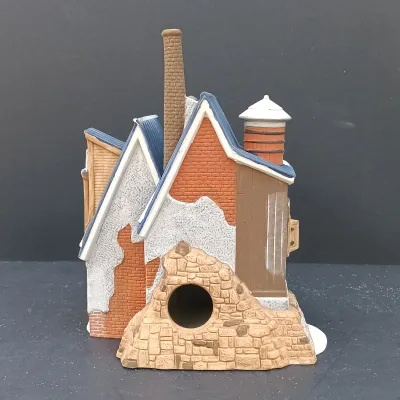 LOT 135: Department 56 New England Village Series Yankee Jud Bell Casting, Livery Stable & Boot Shop and Ben's Barber Shop