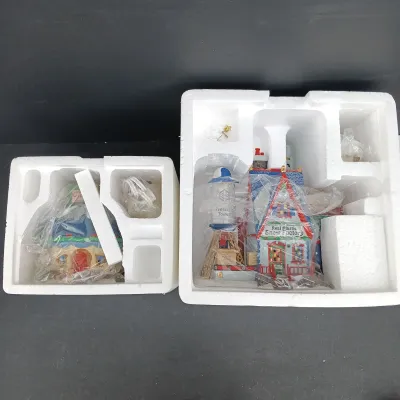 LOT 168: Department 56 North Pole Series Real Plastic Snow Factory and Tillie's Tiny Cup Café
