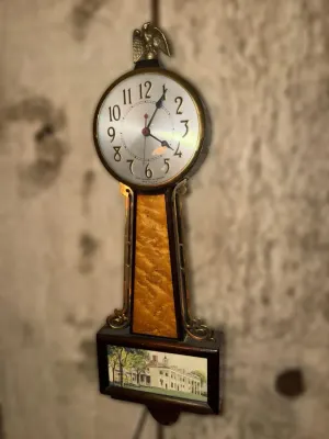 Vintage Sessions banjo wall clock featuring a brass eagle finial, burled wood throat panel, and a lower glass tablet depicting Mount Vernon.