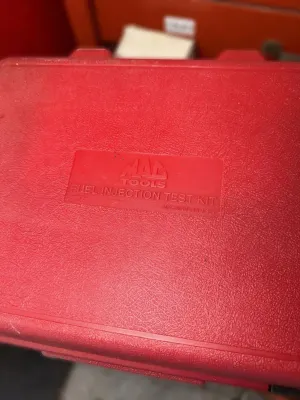 Mac Tools Fuel Injection Test Kit in its original red molded plastic carrying case.
