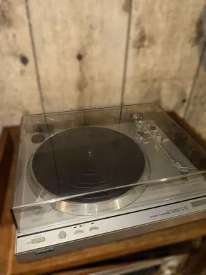 Sony PS-T33 fully automatic direct drive stereo turntable system with a clear dust cover, circa late 1970s to early 1980s.