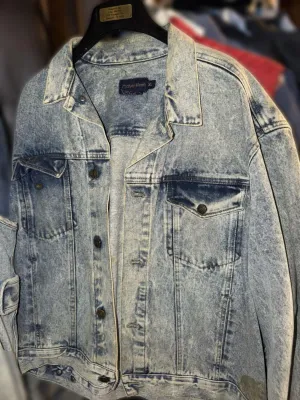 Vintage Calvin Klein acid-wash denim jacket, size XL, featuring classic button-front styling and chest pockets.