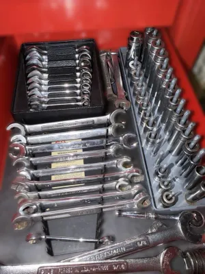 Assorted hand tools including a set of miniature ignition wrenches, various open-end and combination wrenches by Craftsman and Snap-on,...