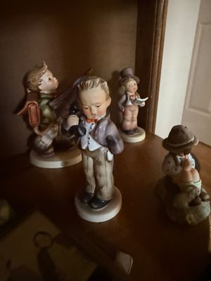 Collection of vintage Goebel Hummel porcelain figurines, including "The Telephone Receiver" and other classic boy characters,...
