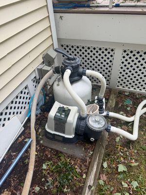 Intex Krystal Clear sand filter pump system for above-ground pools, including the pump, sand tank, and multi-port valve.