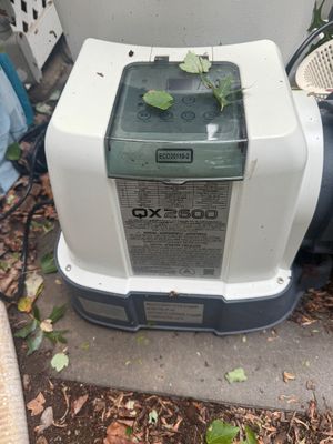Intex QX2600 Krystal Clear sand filter pump and saltwater system, model ECO20110-2, showing some outdoor wear.