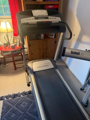 Pro-Form motorized treadmill with digital display console and handrails, shown in gently used condition.